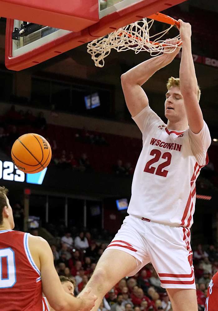 March 14, 2023; Madison, Wisconsin, USA; Wisconsin Badgers forward Steven Crowl (22) dunks during the second half of their opening round game of the National Invitation Tournament against the Bradley Braves at the Kohl Center. Wisconsin beat Bradley 81-62. Mandatory Credit: Mark Hoffman - USA Today Sports